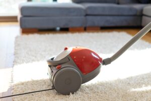 Cleaning floor and carpet with vacuum cleaner
